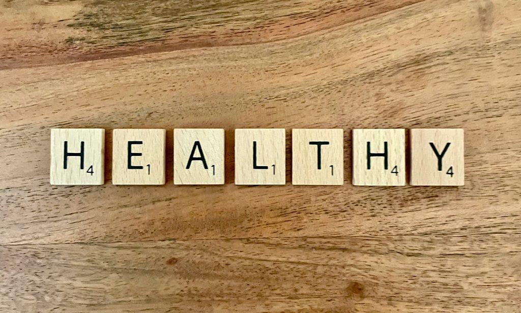 The word "healthy" spelled out in blocks