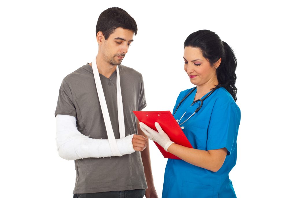 Nurse talking to man in sling