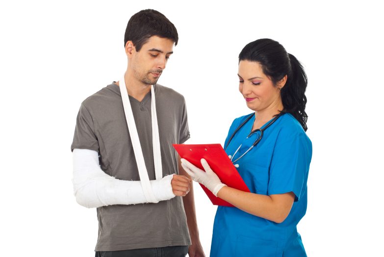 Nurse talking to man in sling