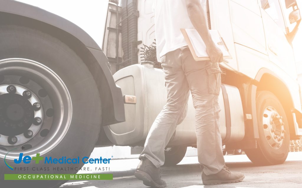 Man walking around semi truck
